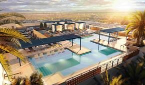 Glendale apartment for rent - A modern poolside area with a view of the city.