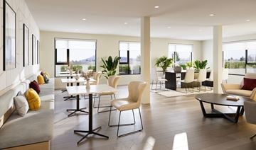 Victoria apartment for rent - A modern living room with a grey sofa, a white table and chairs, and a view of the outdoors.