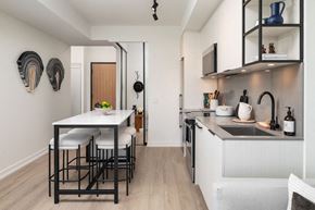 Toronto apartment for rent - A kitchen with a table and chairs.