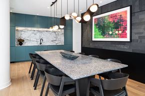Toronto apartment for rent - A modern dining room with a large table and chairs.