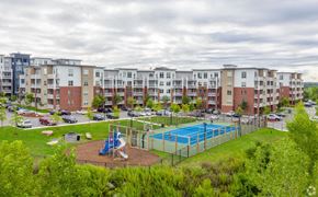 Quincy apartment for rent - an image of an apartment building with a playground