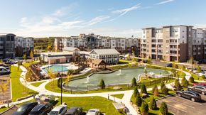 Quincy apartment for rent - an aerial view of a park with a pool and buildings