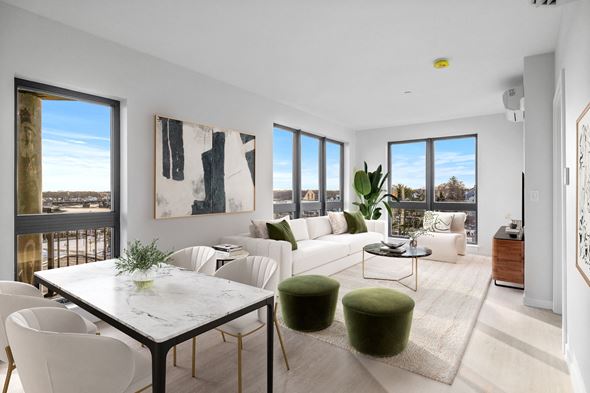 Beverly apartment for rent - A modern living room with a white dining table and white chairs.