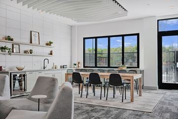 Haverhill apartment for rent - A modern kitchen with a dining table and chairs.