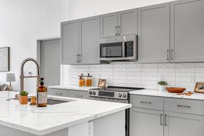 Marlborough apartment for rent - A kitchen with white cabinets and a white countertop.