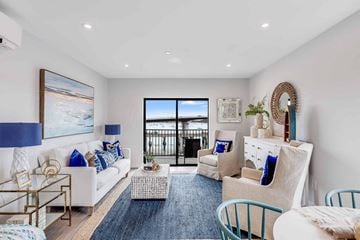 Beverly apartment for rent - a living room with furniture and a door to a balcony