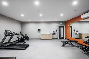 Beverly apartment for rent - the gym with treadmills and other exercise equipment at the flats at west end