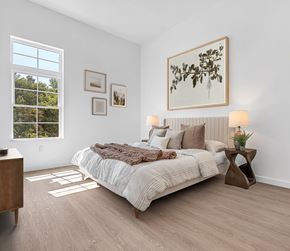 Marlborough apartment for rent - A bedroom with a large bed and a window overlooking trees.