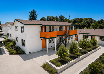 Orangevale apartment for rent - A modern house with a white exterior and an orange accent wall.