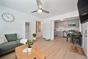 Orangevale apartment for rent - A living room with a green couch and a wooden coffee table.
