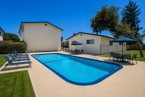 Orangevale apartment for rent - A swimming pool in a backyard with a house in the background.
