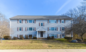 Attleboro apartment for rent - a white house with blue and red shutters and a lawn