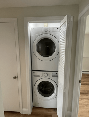 Attleboro apartment for rent - a front loading washer and dryer in a small closet