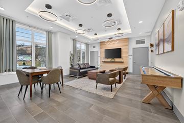 Washington apartment for rent - A modern living room with a pool table and a television.