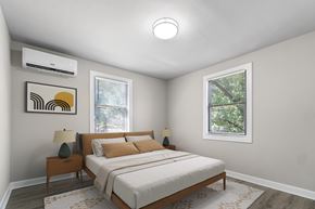 Brentwood apartment for rent - A bedroom with a bed, nightstands, and a window.