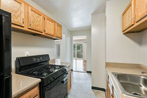 Washington apartment for rent - an empty kitchen with a stove and a sink