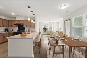 Durham apartment for rent - A modern kitchen with a dining table set for four.