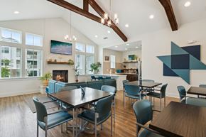 Apex apartment for rent - A modern dining room with a large table and chairs.