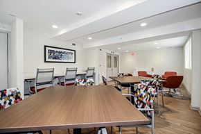 Baltimore apartment for rent - a communal dining room with tables and chairs at the addison apartments