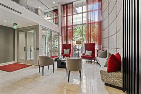 Silver Spring apartment for rent - a lobby of a building with chairs and couches