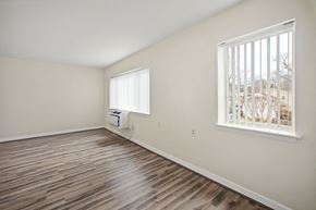 Kensington apartment for rent - a living room with hardwood floors and a large window