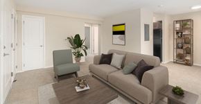 Baltimore apartment for rent - a living room with a couch and a chair