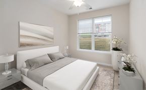 Baltimore apartment for rent - a white bedroom with a white bed and a window
