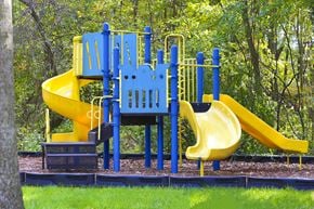 Jessup apartment for rent - A playground with a blue and yellow slide.