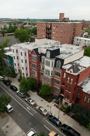 Washington apartment for rent - A city street with cars and buildings.