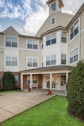 Jessup apartment for rent - A large, two-story house with a covered porch and a garage.