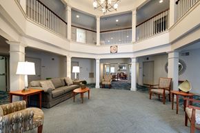 Jessup apartment for rent - A large, open living room with a balcony and a chandelier.