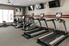Omaha apartment for rent - our gym has a lot of cardio equipment and flat screen tv