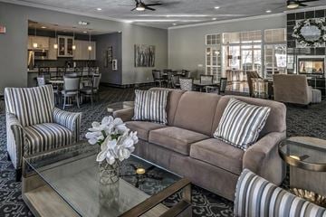 Omaha apartment for rent - a living room with a couch and a glass table