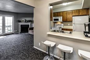 Omaha apartment for rent - a kitchen with a sink and a refrigerator