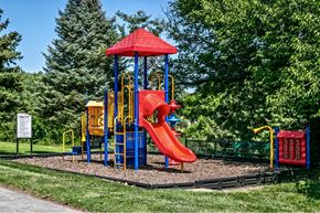 Omaha apartment for rent - a playground with a swing set and a slide