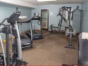 Omaha apartment for rent - a gym with exercise equipment in a home gym