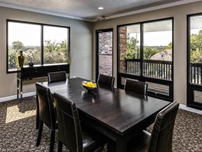 Omaha apartment for rent - a dining room with a table and chairs and windows