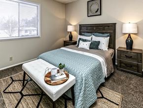 Omaha apartment for rent - a bedroom with a bed and a table