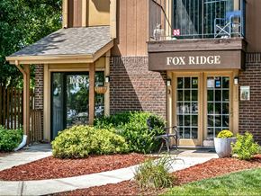 Omaha apartment for rent - a building with a fox ridge sign on the front of it