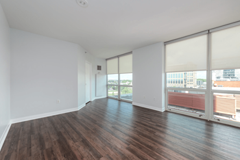 A room with wooden floors and white walls.
