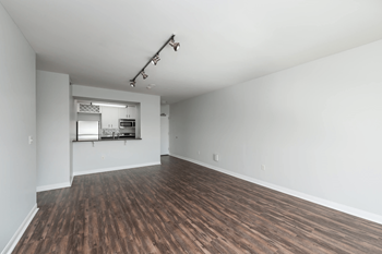 A room with wooden floors and white walls.