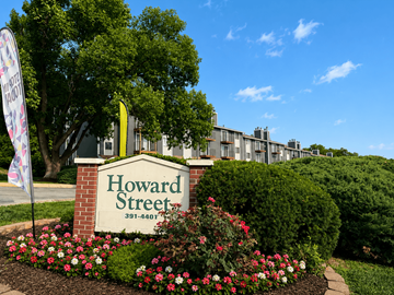Omaha apartment for rent - A sign that says Howard Street in front of a building.