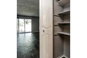 Omaha apartment for rent - the living room of an apartment with a door to the balcony