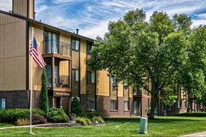 Omaha apartment for rent - a building with an flag in front of it