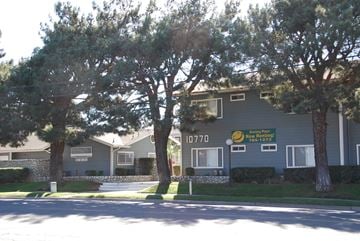Riverside apartment for rent - Apartment complex with a sign that says "10770" on it.