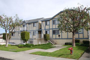 Hawthorne apartment for rent - A building with a red fire hydrant in front of it.