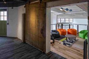 Cleveland apartment for rent - A room with a wooden partition and a black railing.