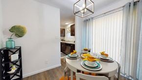 Evansville townhouse for rent - A dining room with a table set for two.