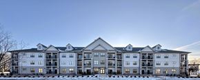 Portland apartment for rent - A large, multi-story residential building with a flat roof and multiple balconies.