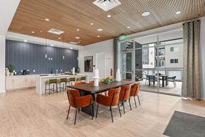 Albuquerque apartment for rent - A modern dining room with a long table and chairs.